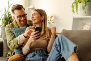 Male and female on couch